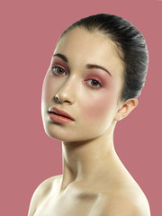 beautiful brunette with hair collected and light pink makeup