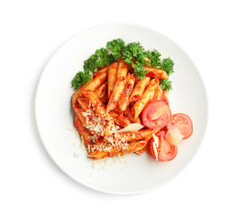 Plate with delicious penne pasta and garnish on white background