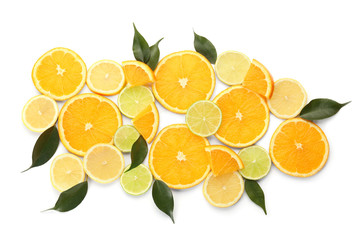 Composition with cut citrus fruits on white background