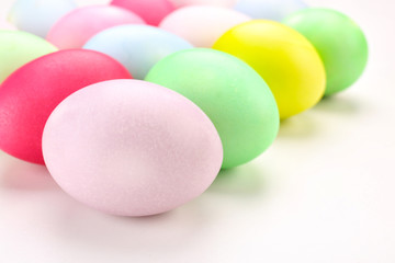 Dyed Easter eggs on white background, closeup
