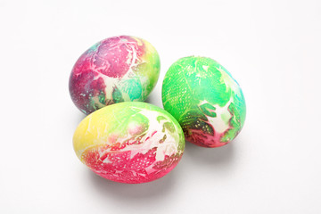 Dyed Easter eggs on white background