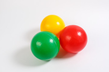 educational kids colored plastic balls toys on white background.