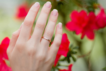 Fototapeta premium Beautiful wedding bride's ring and manicure.