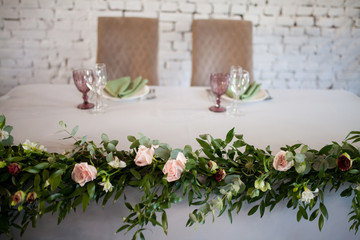 Wedding table decorated with flowers.