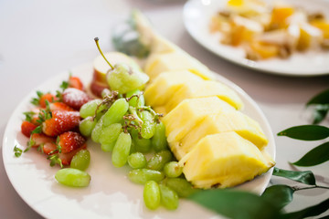 Beautifully decorated fruits on the plate at restaurant.