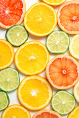 Sliced ripe citrus fruits as background