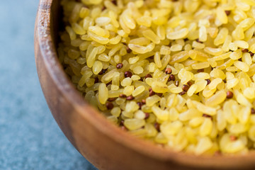 Uncooked Raw Bulgur Rice with Quinoa in Wooden Bowl. / Bulghur for Pilav or Pilaf