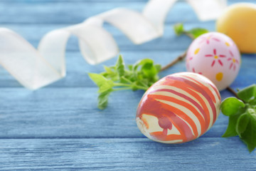 Fototapeta na wymiar Colorful Easter eggs on wooden background
