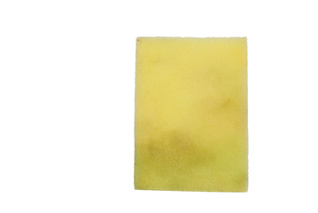 Yellow side of used scrub sponge isolated on white background, the sponge has some stain