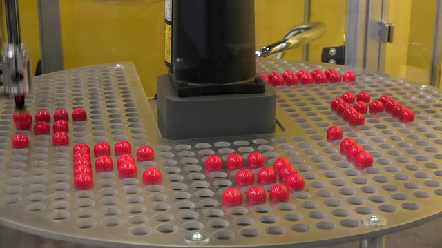 robot moving red balls 