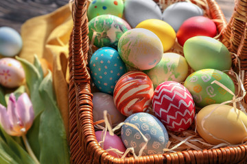 Easter basket with colorful eggs, closeup