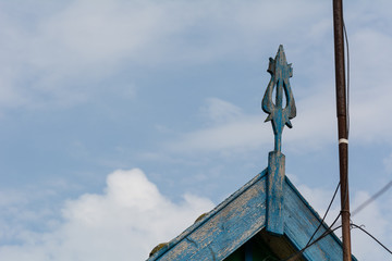 Fototapeta premium Facade of a rural house, roof decorative element