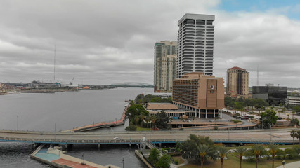 Fototapeta premium JACKSONVILLE, FL - APRIL 7, 2018: Aerial city view on a cloudy day. Jacksonville is a famous attraction in Florida