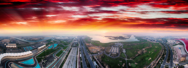 Yas Island, Abu Dhabi. Panoramic aerial view of main landmarks at dusk, United Arab Emirates