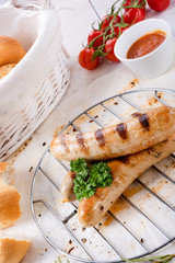 delicious bratwurst with ketchup and fresh rolls