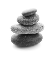 Stack of spa stones on white background