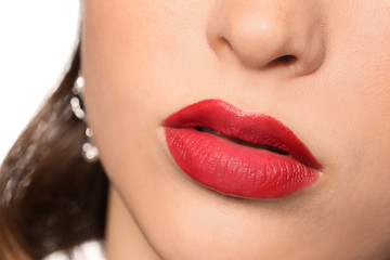 Fototapeta premium Beautiful young woman with bright lipstick, closeup
