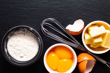 Base of Bakery preparation butter, flour, egg yolks on black slate stone