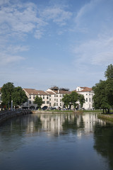 Fototapeta na wymiar Treviso, Italy - May 29, 2018: View of the River Sile in Treviso