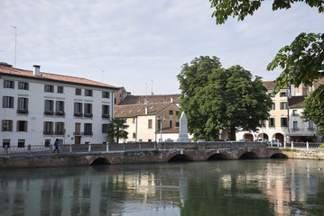 Fototapeta na wymiar Treviso, Italy - May 29, 2018: View of the River Sile in Treviso