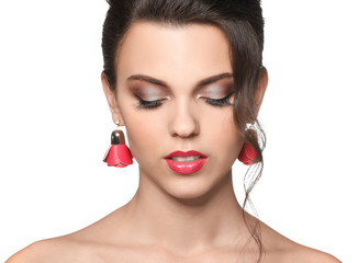 Portrait of young woman with beautiful professional makeup on white background