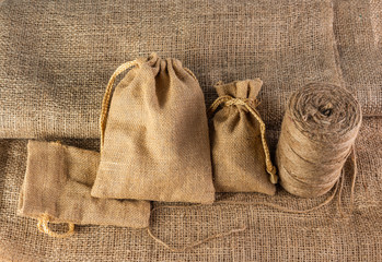 hemp products, such as, sackcloth, bag and rope - obrazy, fototapety, plakaty