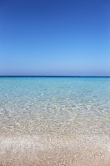 Fototapeta na wymiar Tropical background with white sand beach