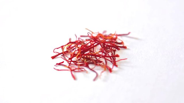 Saffron spice footage circling on white background

