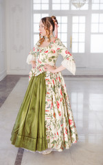 Beautiful woman in long green medieval dress