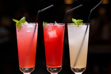 Close up three glasses of soft drink. Three different summer lemonade with mint