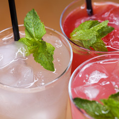 Three various summer milkshakes in glasses