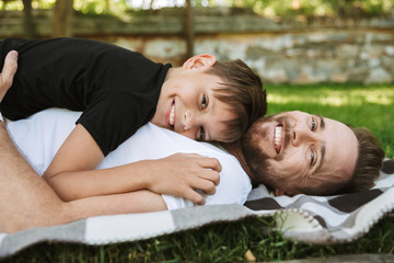 Happy young father with his little son