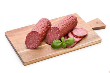 Salami smoked sausage, basil leaves on white background cutout.