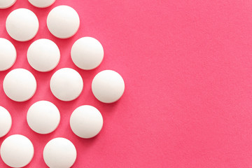 Pills on color background