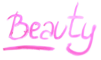 Word BEAUTY written with lipstick on white background. Professional cosmetics