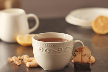 Fototapeta na wymiar Cup with delicious tea on table