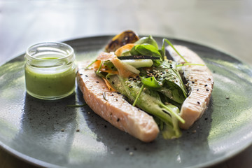 Steamed salmon with vegetable on the plate