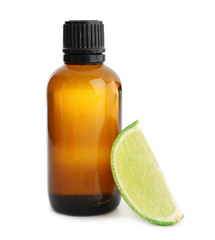 Bottle with lime essential oil on white background