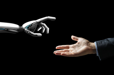 artificial intelligence, future technology and communication concept - robot and human hand over...