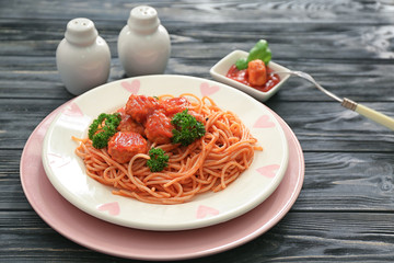 Plate with spaghetti and meatballs on table. Delicious pasta recipes