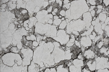 The texture of the stone slab in cracks and stains.