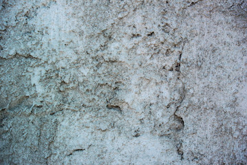 Photograph of rough weathered concrete wall texture