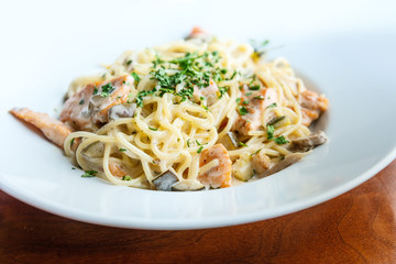 tasty pasta with salmon on a the table
