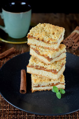 Pieces of grated pie with caramel