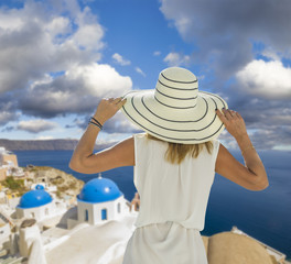 Woman on Santorini's roof top