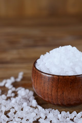 Fototapeta na wymiar Big sea salt in a wooden bowl