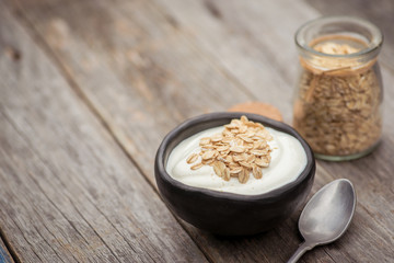 Yogurt. Stone bowl with fresh yogurt on rustic table
