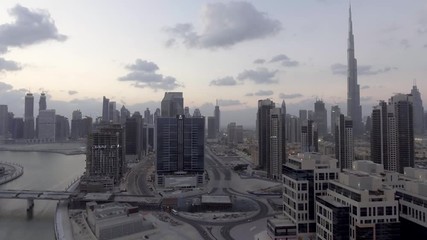 DUBAI - DECEMBER 2016: Aerial view of Downtown skyscrapers at sunset. The city attracts 20 million tourists annually