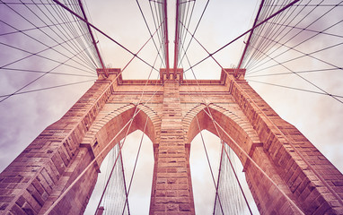 Looking up at the Brooklyn Bridge, color toned picture, New York City, USA.