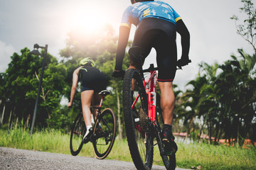 Cycling athlete on natural side road